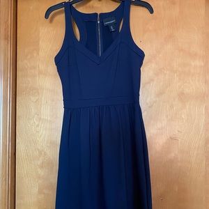 Navy blue, gold zipper in the back, thick material